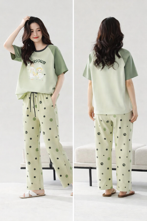 Woman wearing a green and white pajama set with polka dot pants, shown from front and back views.