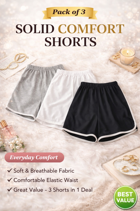 Three pairs of solid comfort shorts in gray, white, and black on a light background with product details.